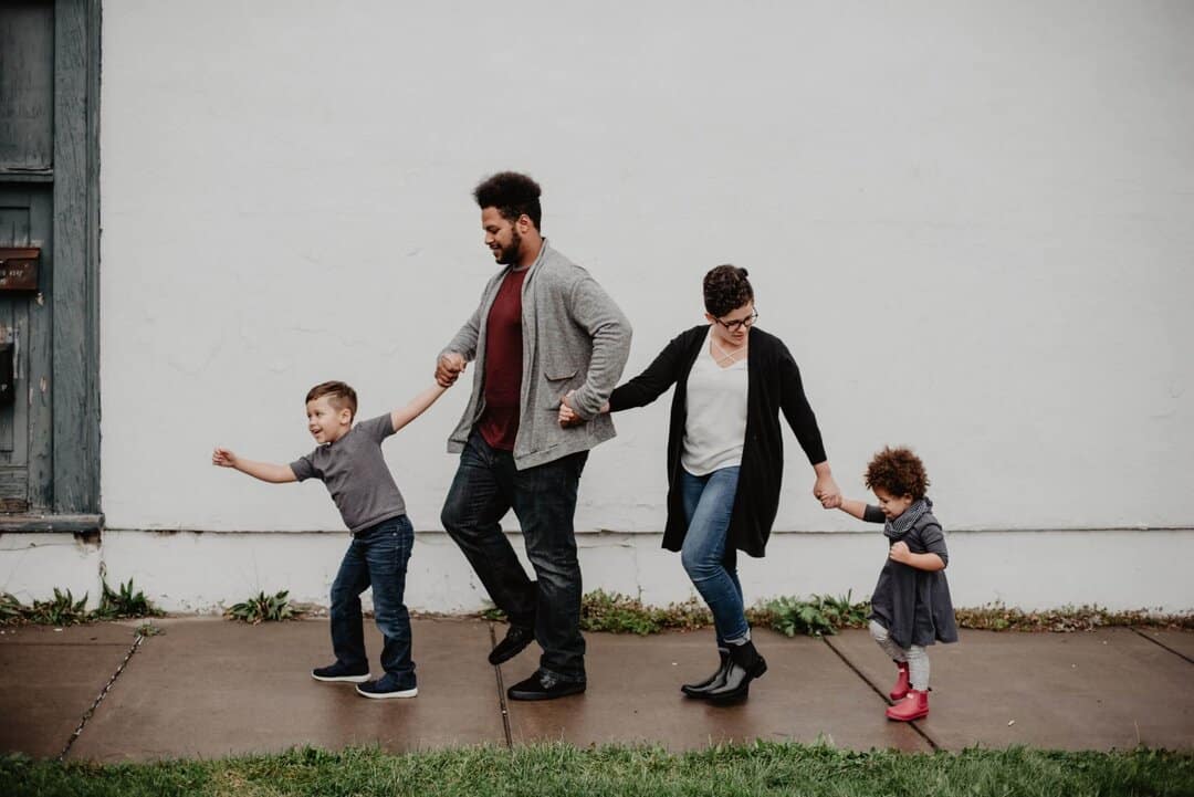 Family With Adopted Children Walking